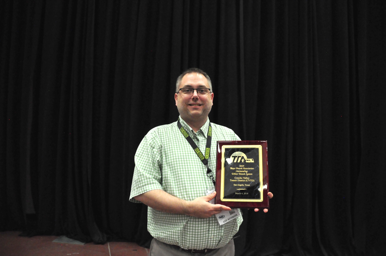 Steve holding CVTD's 2019 Texas Transit Association Outstanding Urban Transit System award